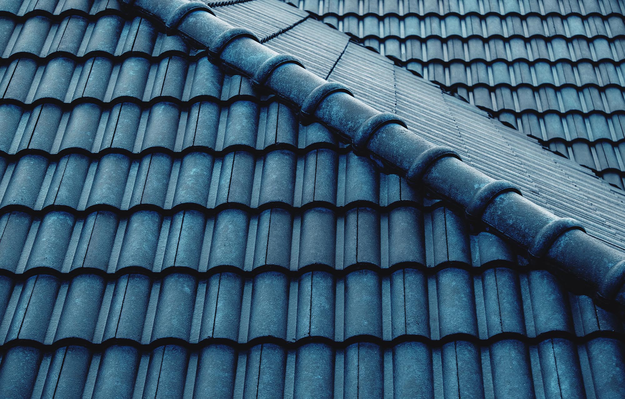 Wet Blue Tiles Roof Pattern. Shot on Rainy Day. Details of Archi